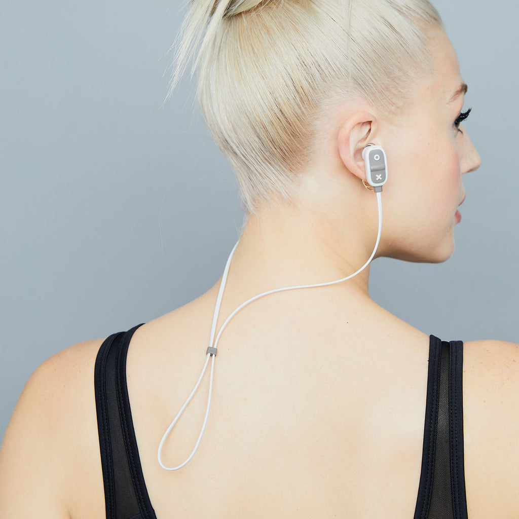 Woman wearing Jam Audio Live Large Wireless Bluetooth® Grey Earbuds